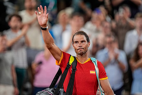 Rafael Nadal waves fans after losing doubles quarter-final